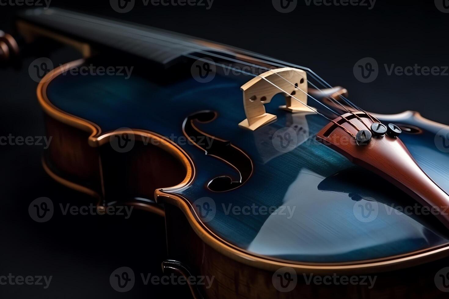 Classic violin on dark blue background in closeup. photo