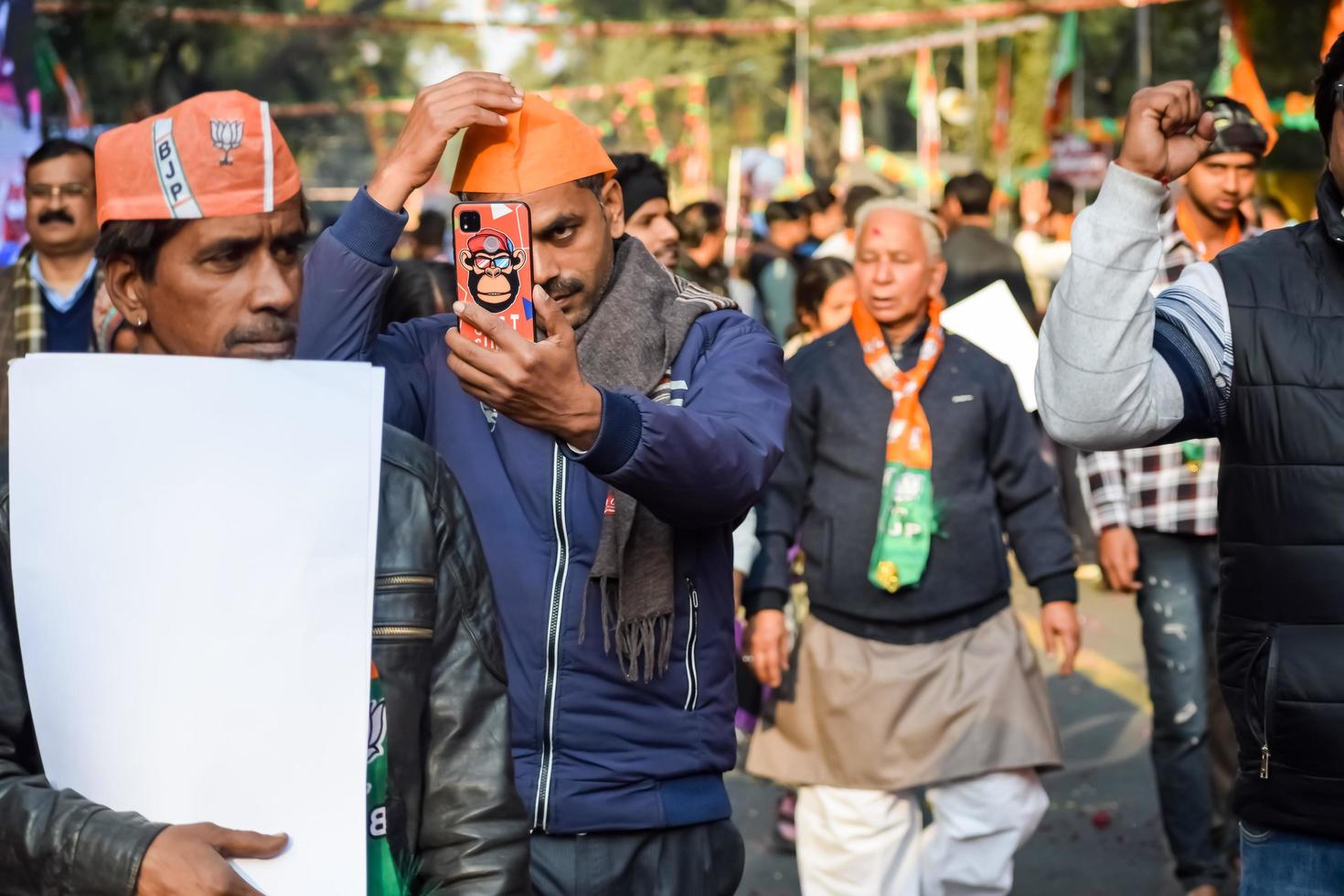 New Delhi, India - January 16 2023 - Thousands of people collected during Prime Minister Narendra Modi BJP road show, people during PM Modi big election rally in the capital photo