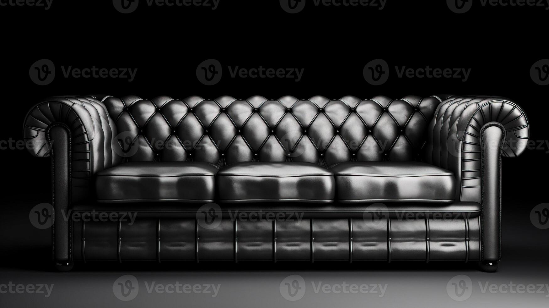 Chesterfield sofa made of black leather on a dark background, isolate