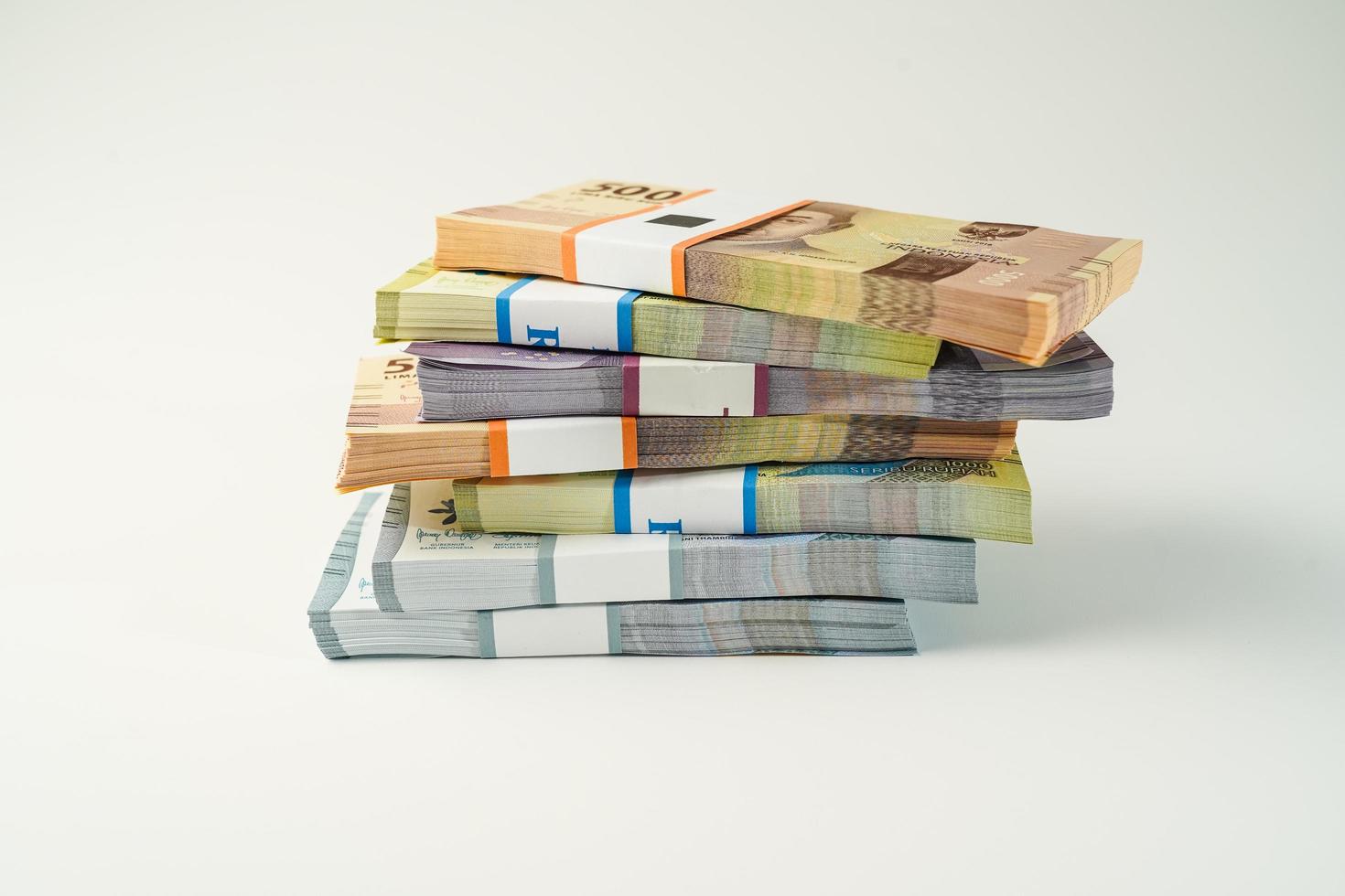 Jakarta, Indonesia, April 15, 2023, various bundles of Indonesian rupiah banknotes in the IDR currency thousands copy space thr zakat photo