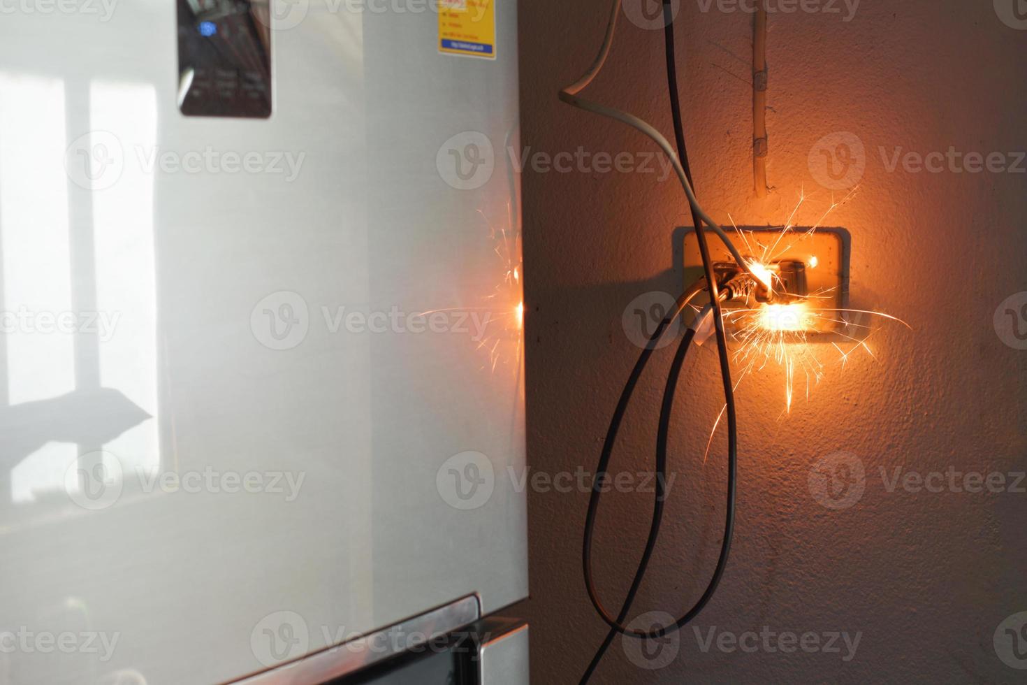 electrical plug sparking and burning Caused by a short circuit, concept, danger from using non-standard equipment, defective equipment photo