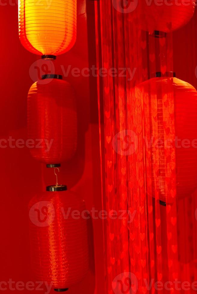 red Chinese lantern decoration room background with hearts shape curtain photo