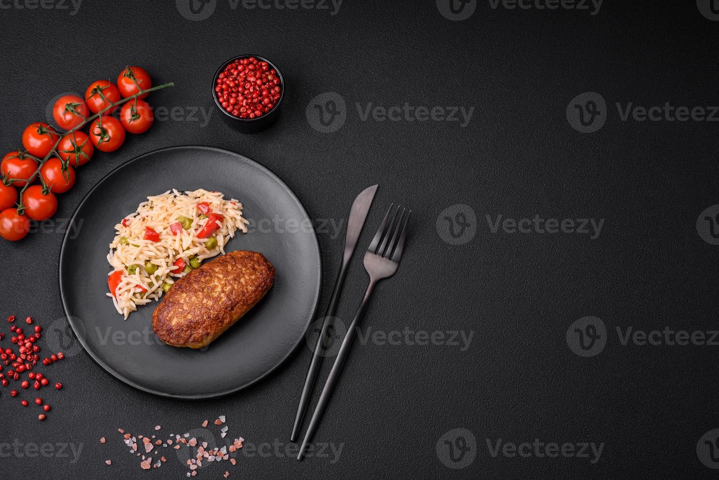 Delicious fried cutlets or meatballs of minced fish with rice photo