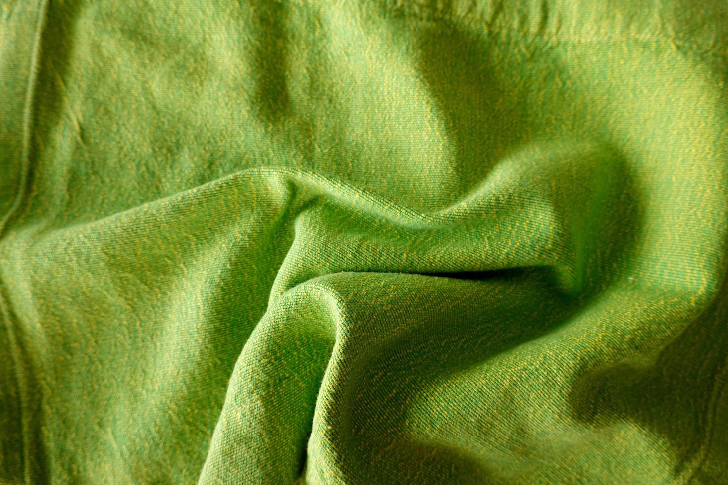Texture, background, pattern. Texture of green wrinkled fabric. photo