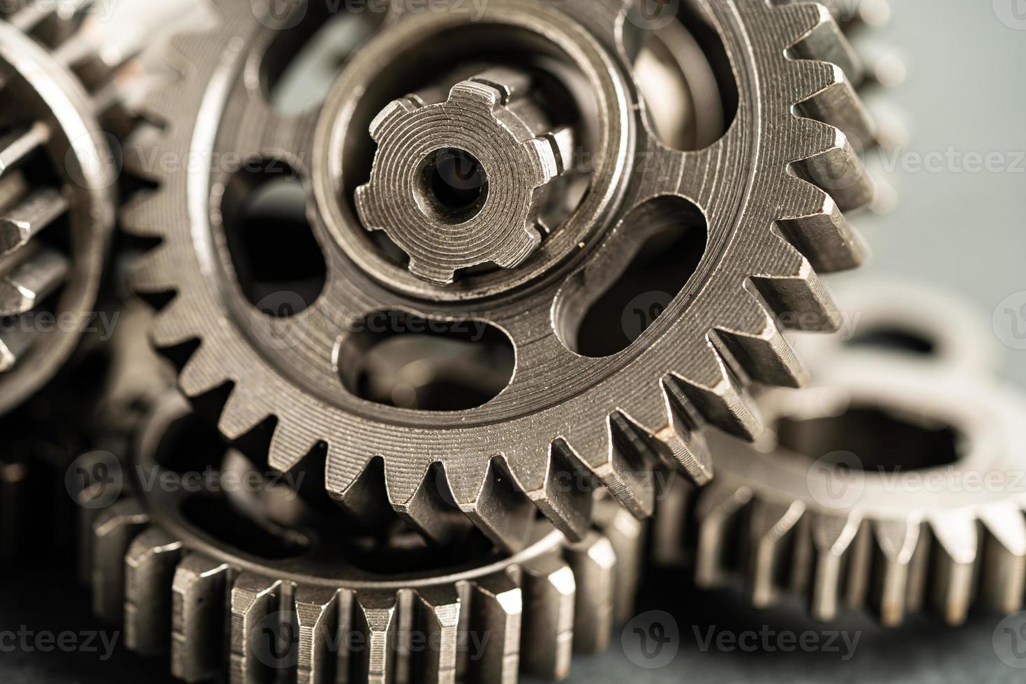 Gear and cogs wheels, clock mechanism, brass metal engine industrial. photo