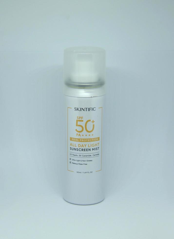 Jakarta, Indonesia - April 21th, 2023 - Skintific sun screen spray spf 50 solar uv block product object photography isolated on plain white landscape horizontal background. photo
