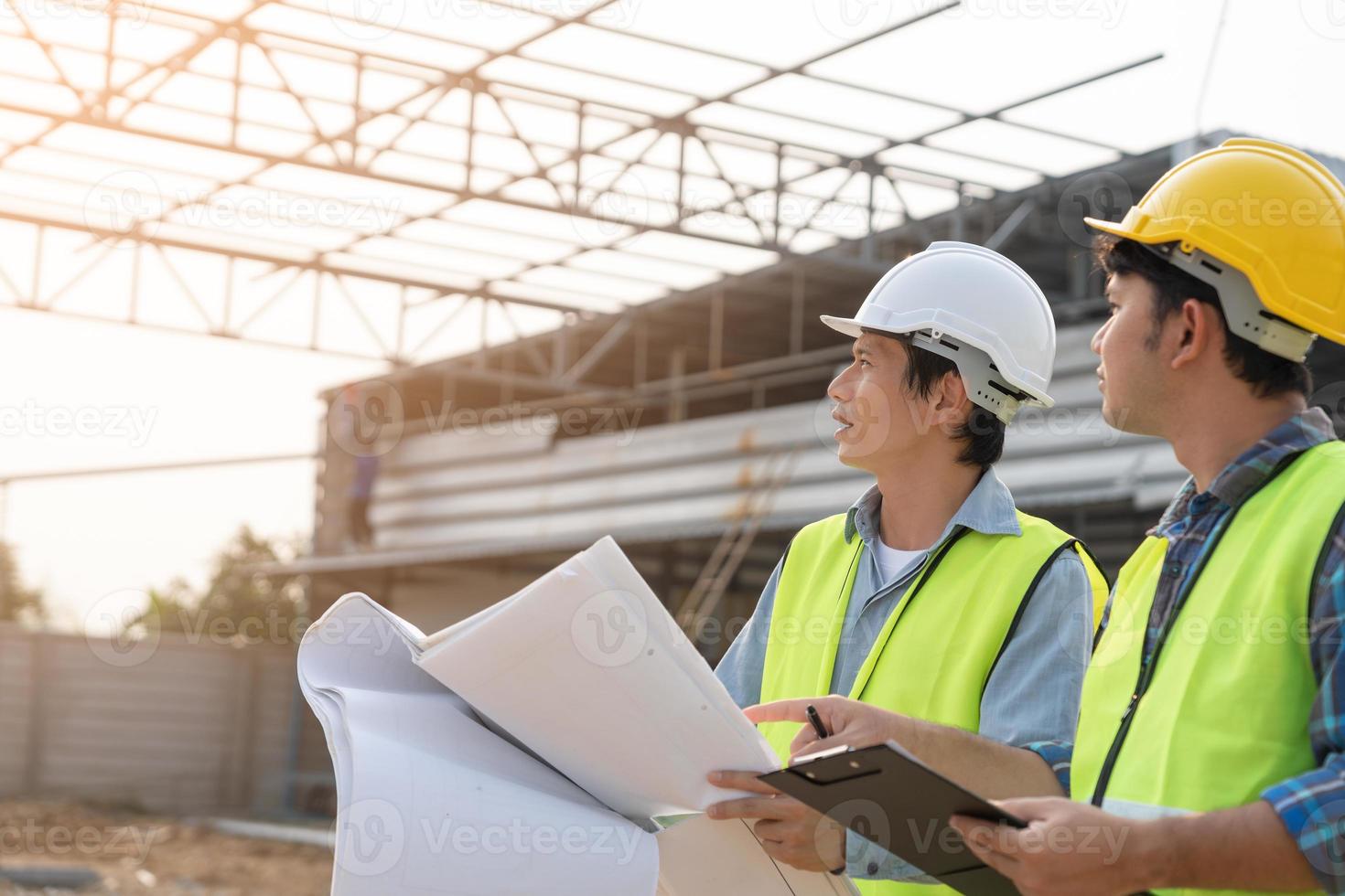 Engineers use blueprint check construction on site. Contractor and inspector inspection construction during project.civil Forman check quality assurance. Audit, inspect, quality control. photo