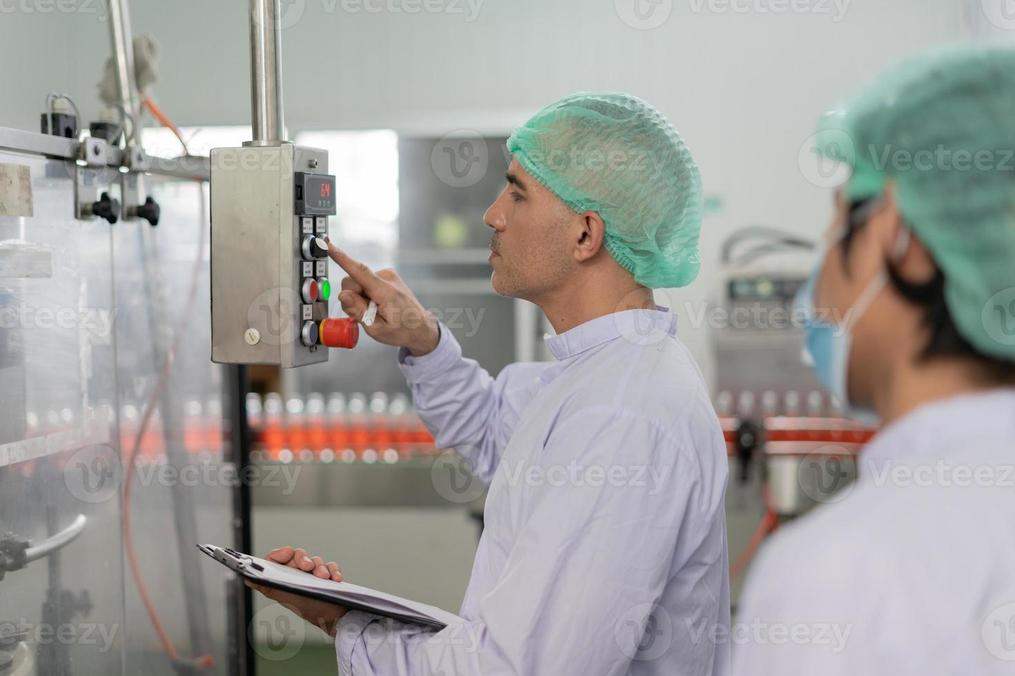 quality supervisor or food or beverages technician inspection about condition control food or beverages before send product to the customer. Production leader recheck machine and productivity. photo