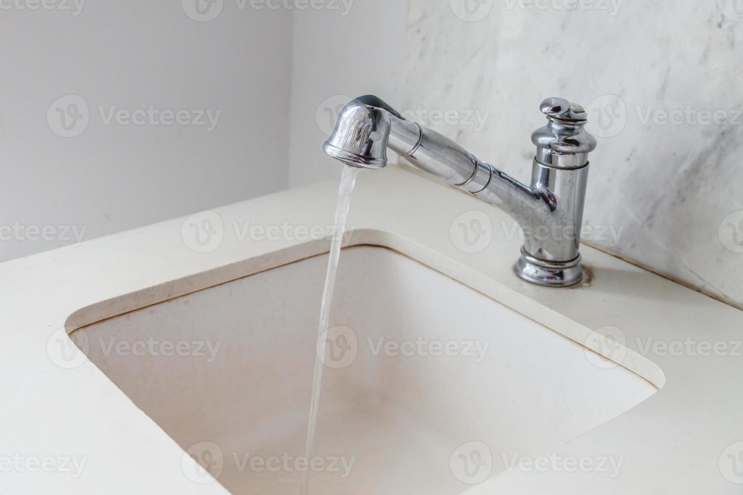 Water drop from faucet photo