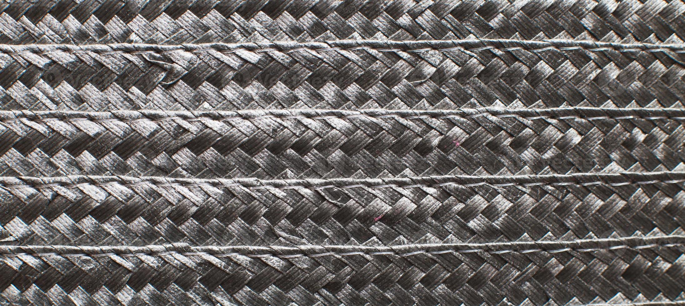 Black textured surface of wicker woven basket. banner photo