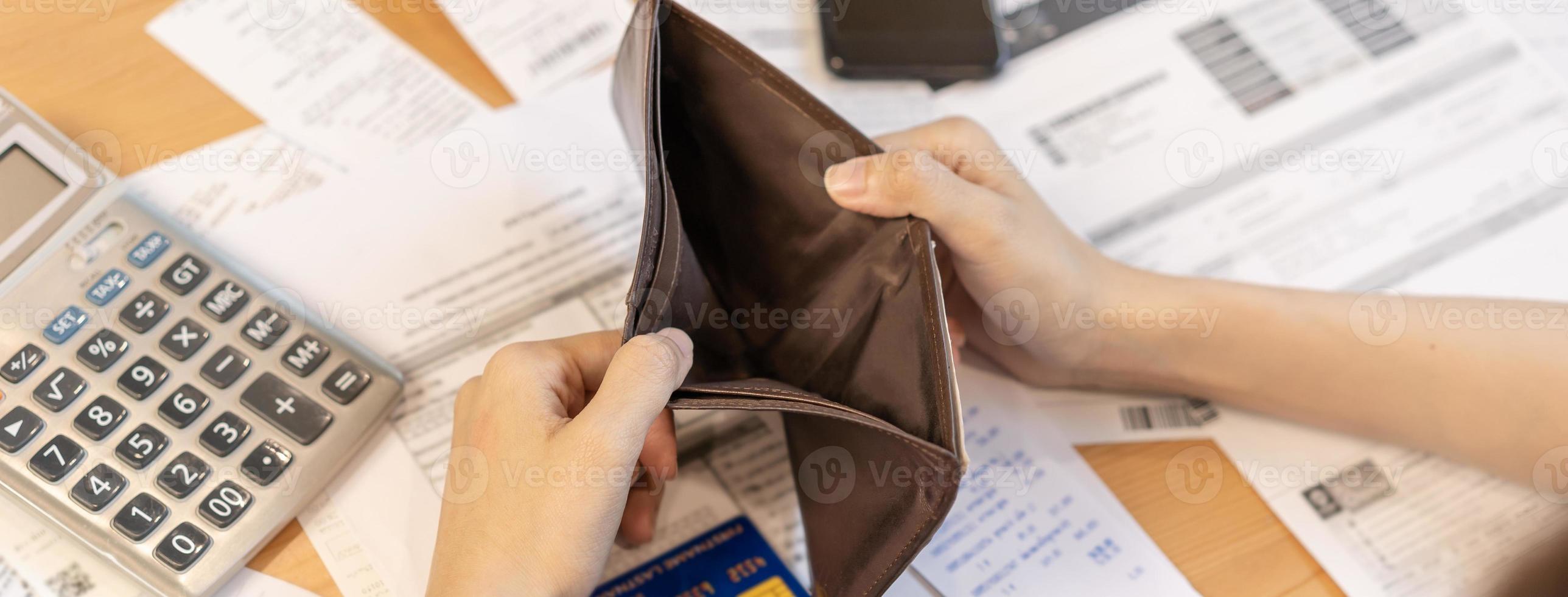 Stressed, Problem business person woman holding and open empty wallet, purse no have money for bill payment, credit card loan or expense. Bankruptcy, bankrupt or debt financial, mortgage concept. photo