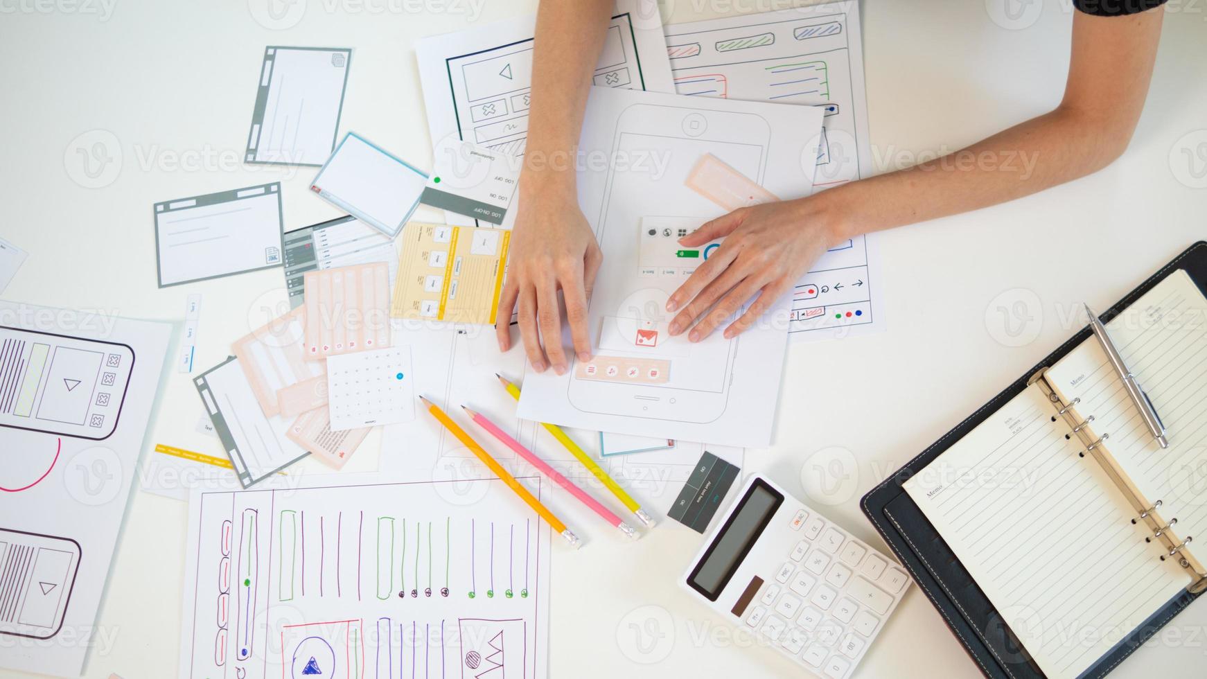 Mobile application developers are designing a ux ui system to make the display on the phone screen go smoothly because the ux ui system in a mobile phone affects the operation of various applications. photo