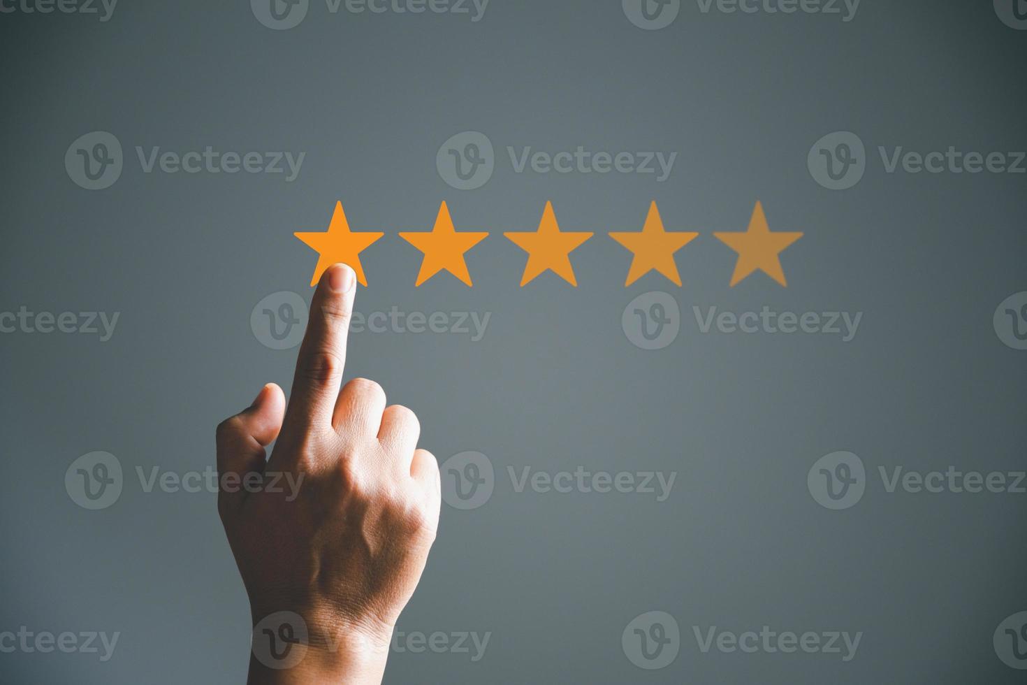 Customer service and Satisfaction concept, Business person are touching the virtual screen on happy Smiley face icon to give satisfaction in service. rating very impressed. customer service feedback. photo