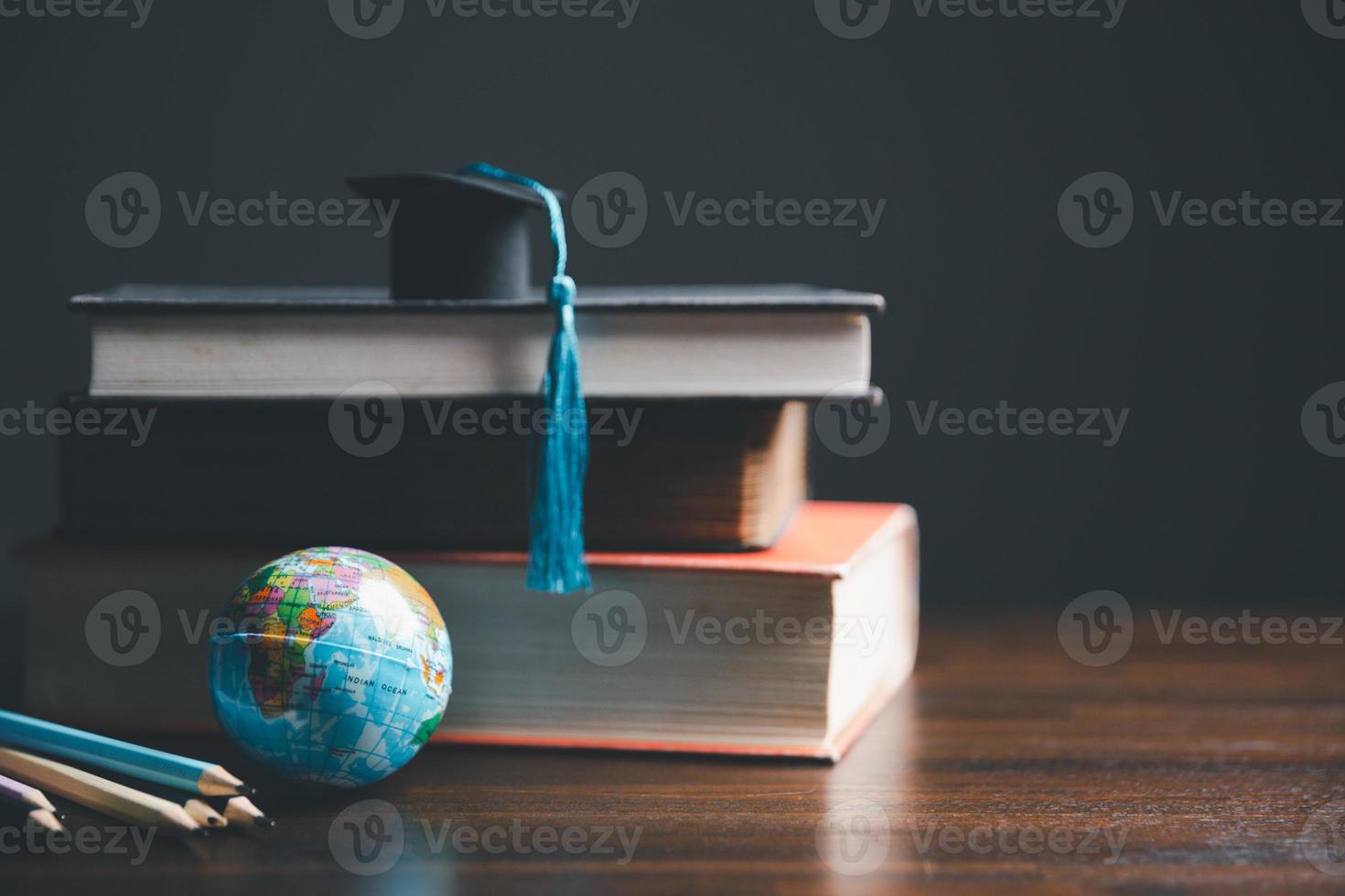 Graduation cap with Earth globe. Concept of global business study, abroad educational, Back to School. Education in Global world, Study abroad business in universities in worldwide. language study photo