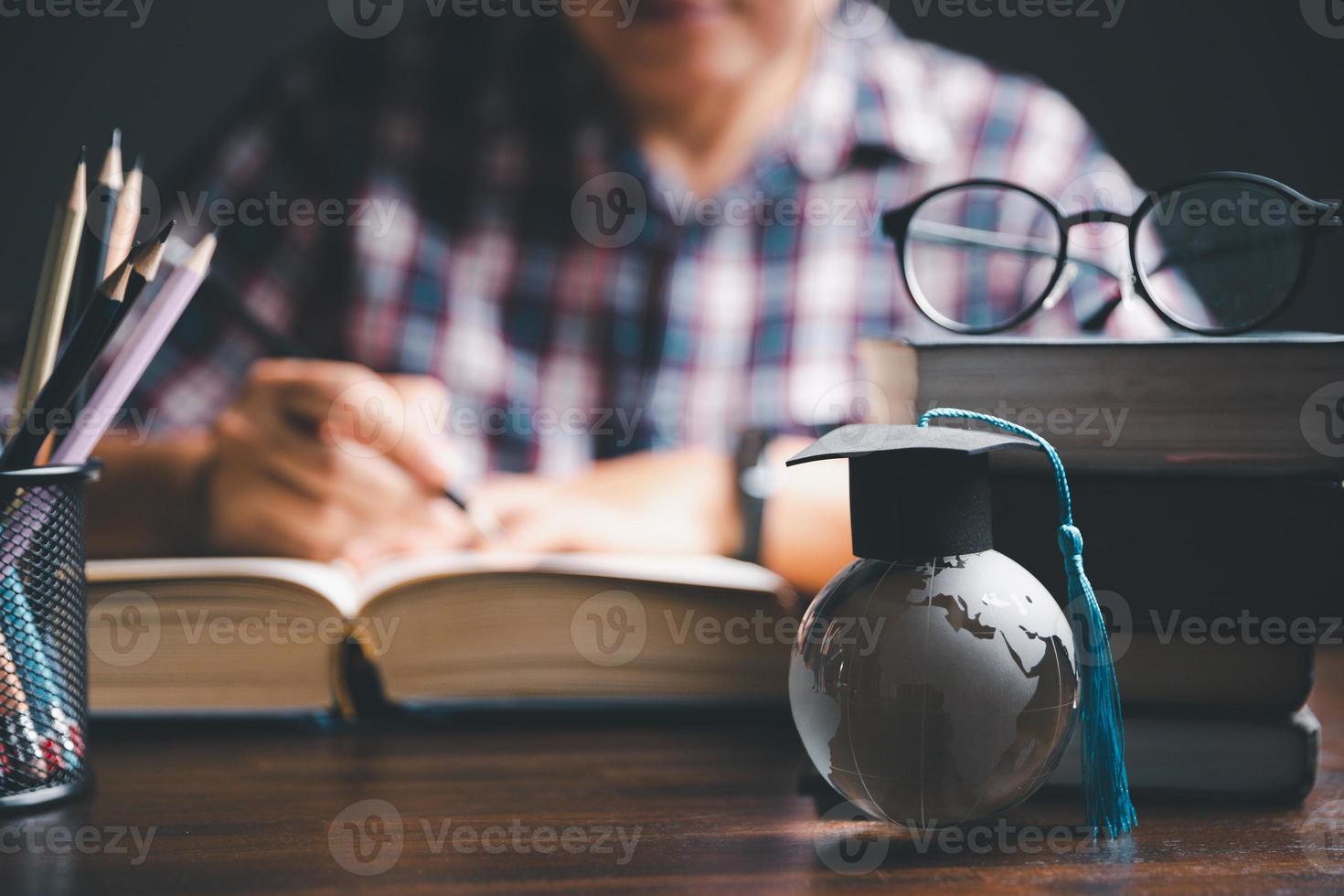 Graduation cap with Earth globe. Concept of global business study, abroad educational, Back to School. Education in Global world, Study abroad business in universities in worldwide. language study photo
