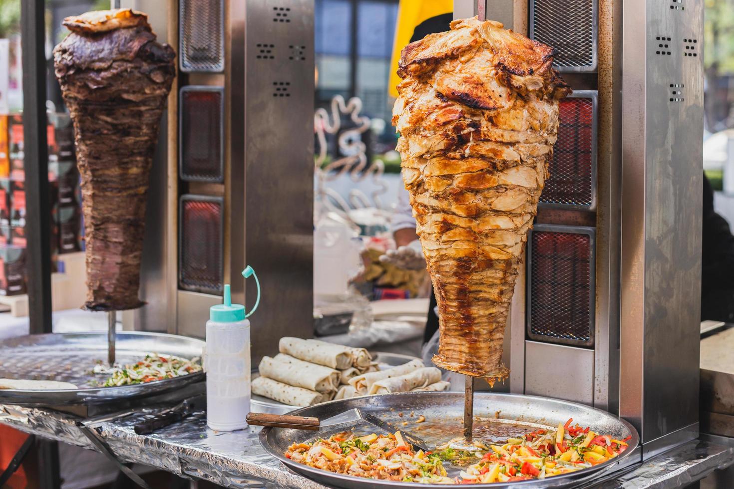 Traditional turkish food chicken doner and beef doner kebab on street vedor. photo