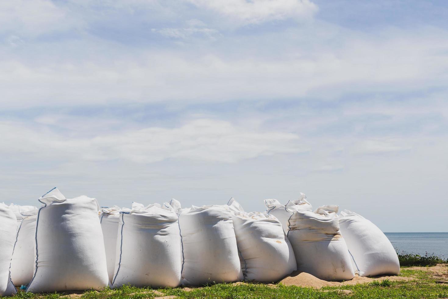 Big bags of sea sand on the beach. photo