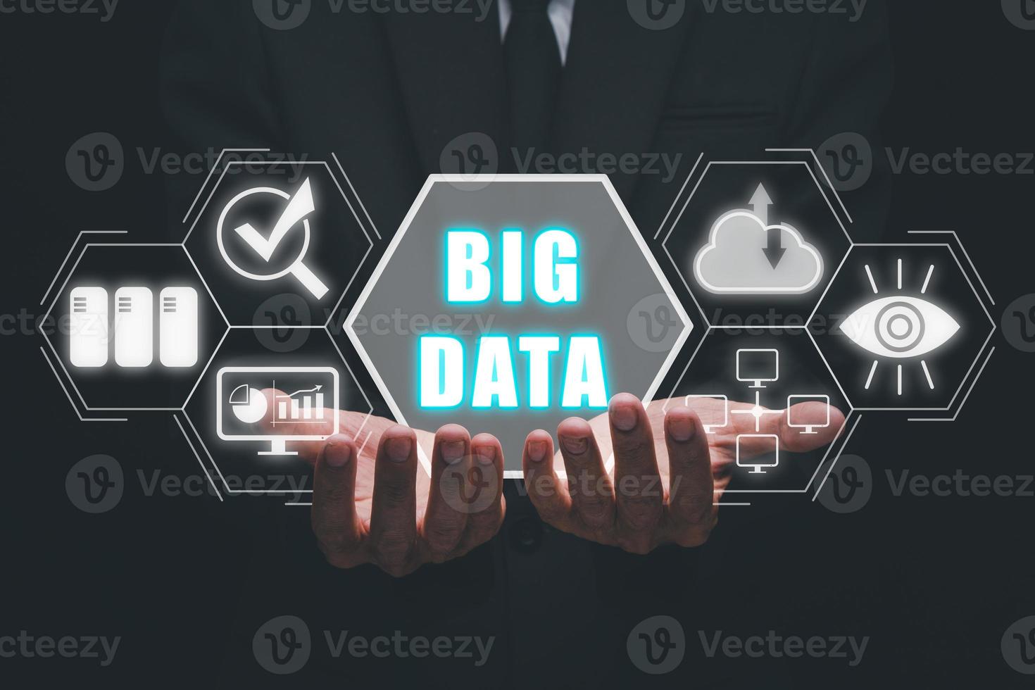 Big data concept, Business person hand holding big data icon on virtual screen. photo