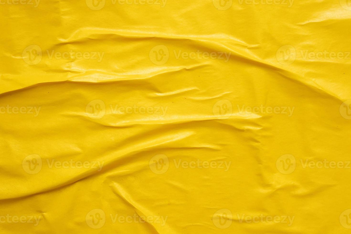 Blank yellow crumpled and creased paper poster texture background photo