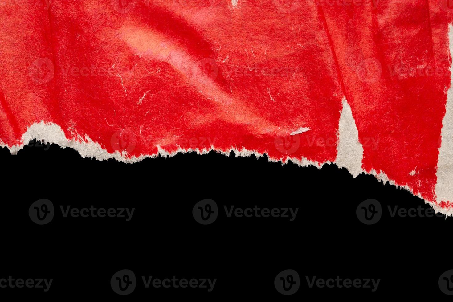 Red ripped paper torn edges strips isolated on black background photo