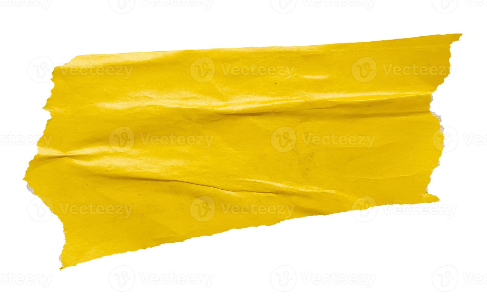 piece of yellow paper tear isolated on white background photo