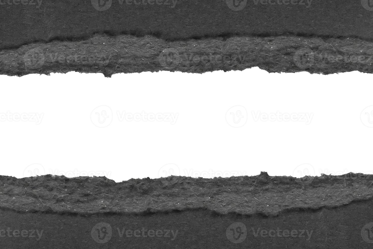 Black ripped paper torn edges strips isolated on white background photo