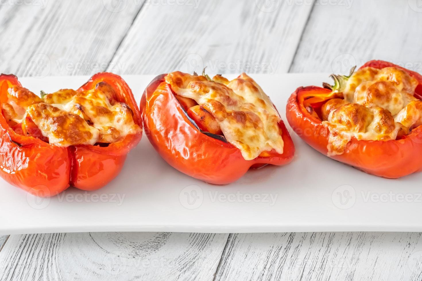 Baked bell peppers stuffed with sausage photo