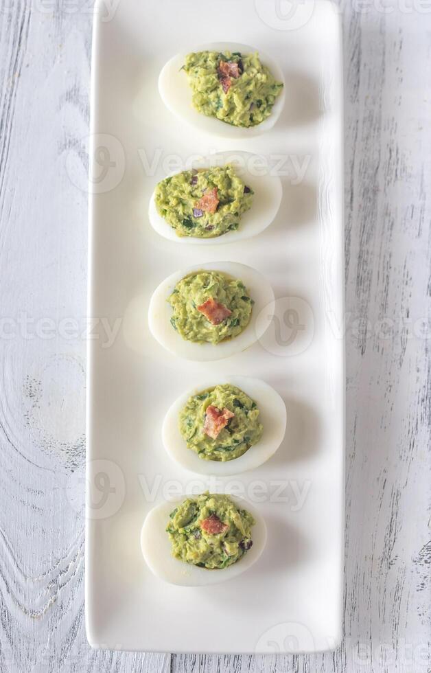 Guacamole and bacon deviled eggs 23160076 Stock Photo at Vecteezy