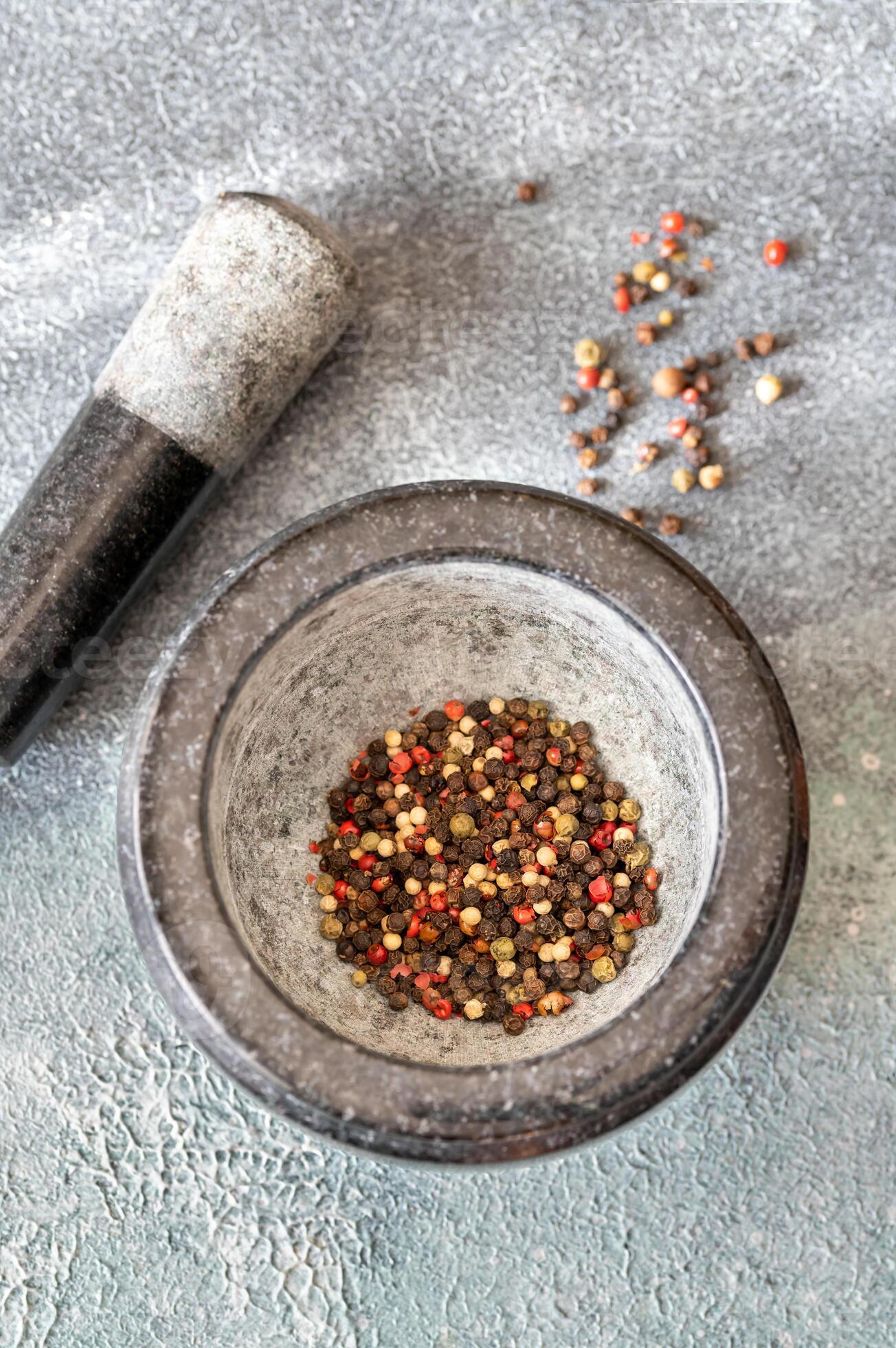 Grinding of peppercorn mix 23160093 Stock Photo at Vecteezy