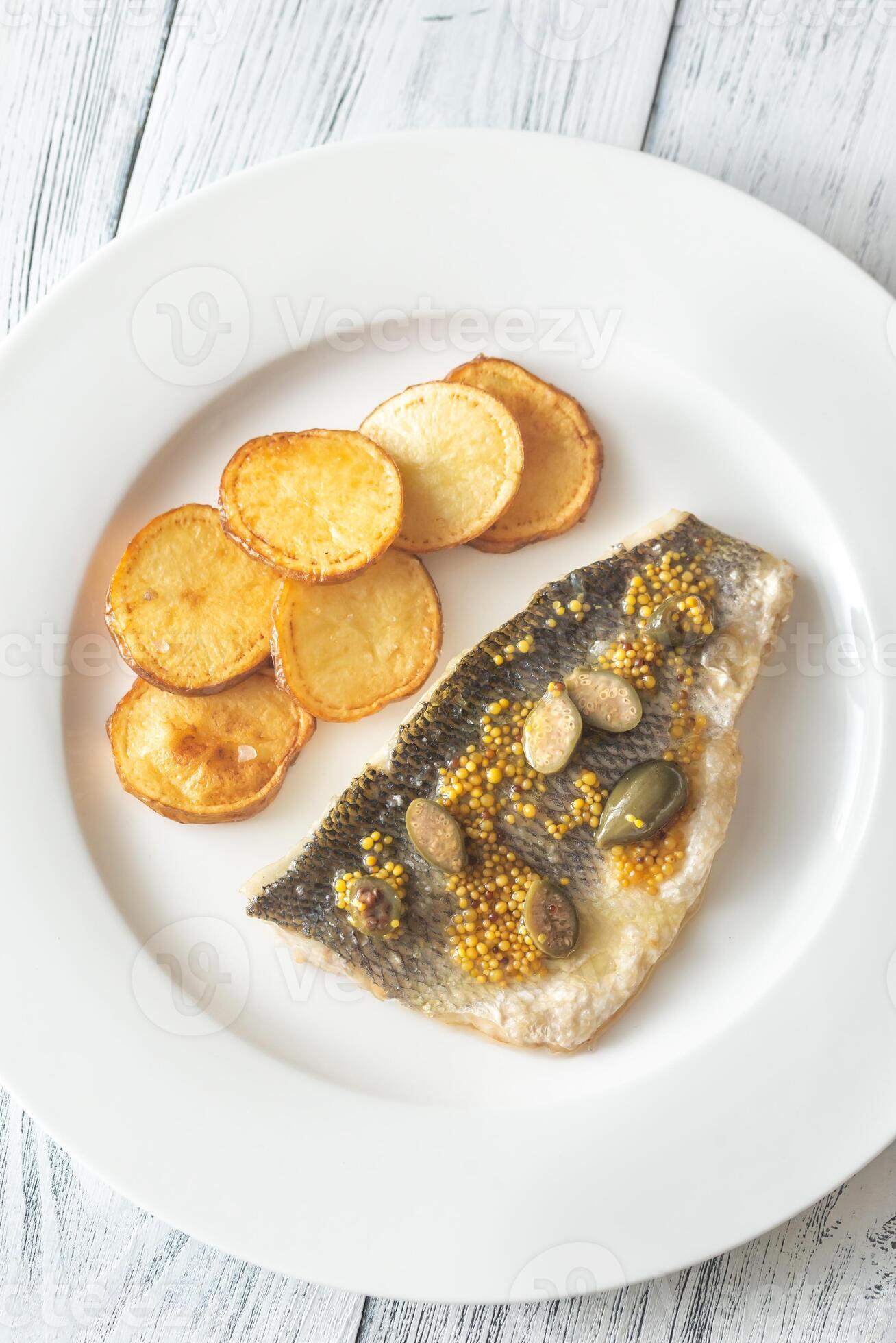 Baked sea bass with capers 23160141 Stock Photo at Vecteezy