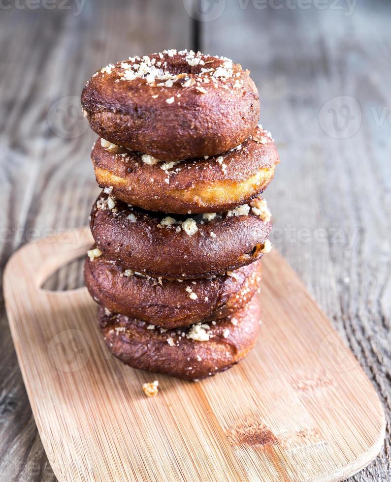 Stack of donuts on the wooden board photo