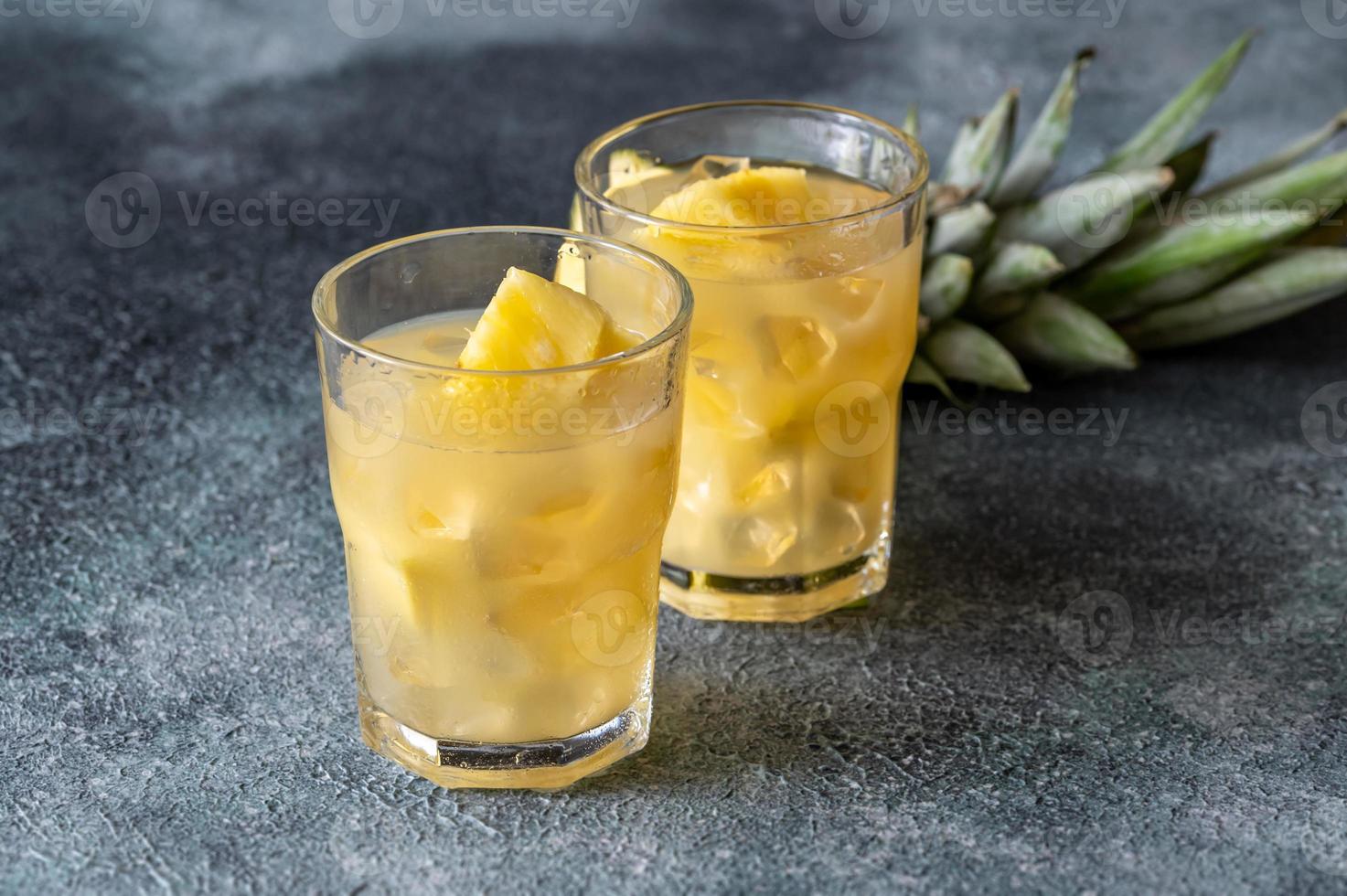 Two glasses of pineapple juice photo