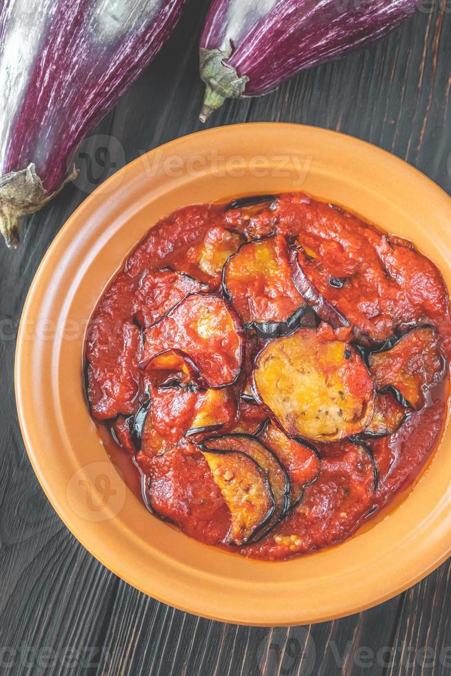 Fried eggplant with tomato sauce photo
