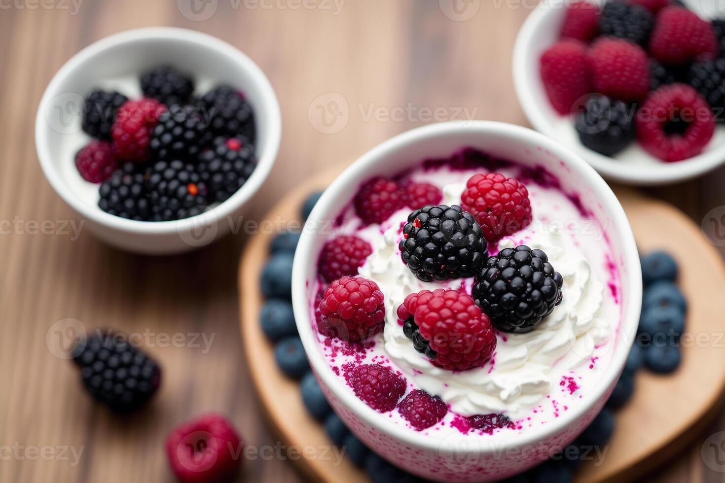 Strawberry yogurt in a white bowl.Yogurt with fresh blackberries, raspberries. photo