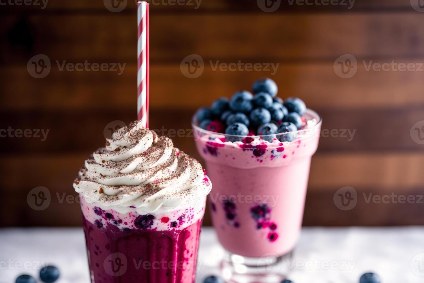 A glass of milkshake with whipped cream and blackberries.Strawberry milkshake, Raspberry milkshake. photo