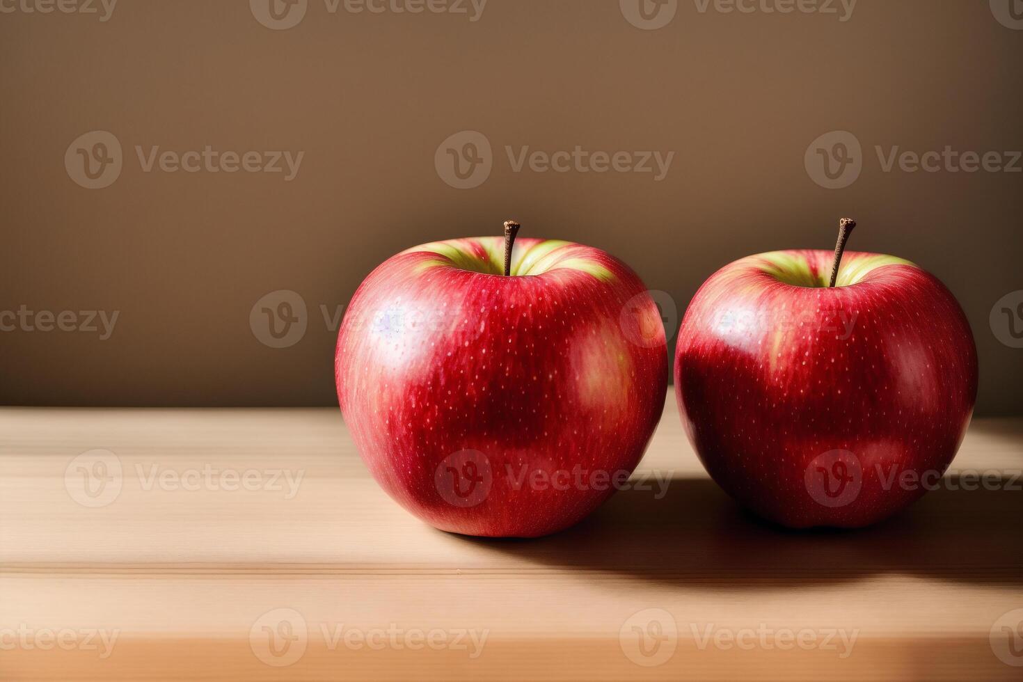 delicious Red apples on a wooden table and brown background. Healthy food concept. photo
