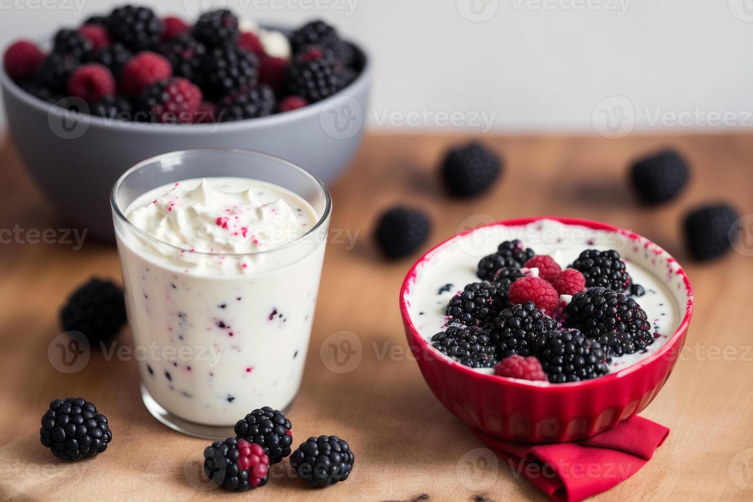 Strawberry yogurt in a white bowl.Yogurt with fresh blackberries, raspberries. photo