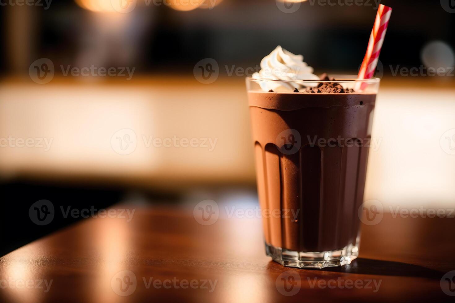 A glass of milkshake with whipped cream and blackberries.Strawberry milkshake, Raspberry milkshake. photo