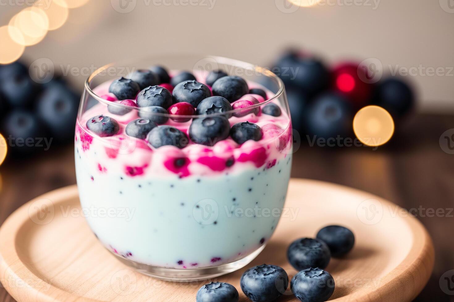Strawberry yogurt in a white bowl.Yogurt with fresh blackberries, raspberries. photo