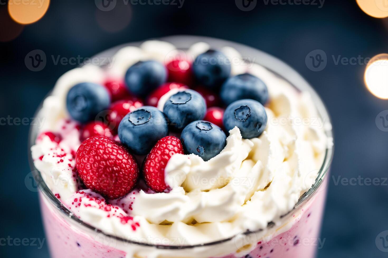 A glass of milkshake with whipped cream and blackberries.Strawberry milkshake, Raspberry milkshake. photo