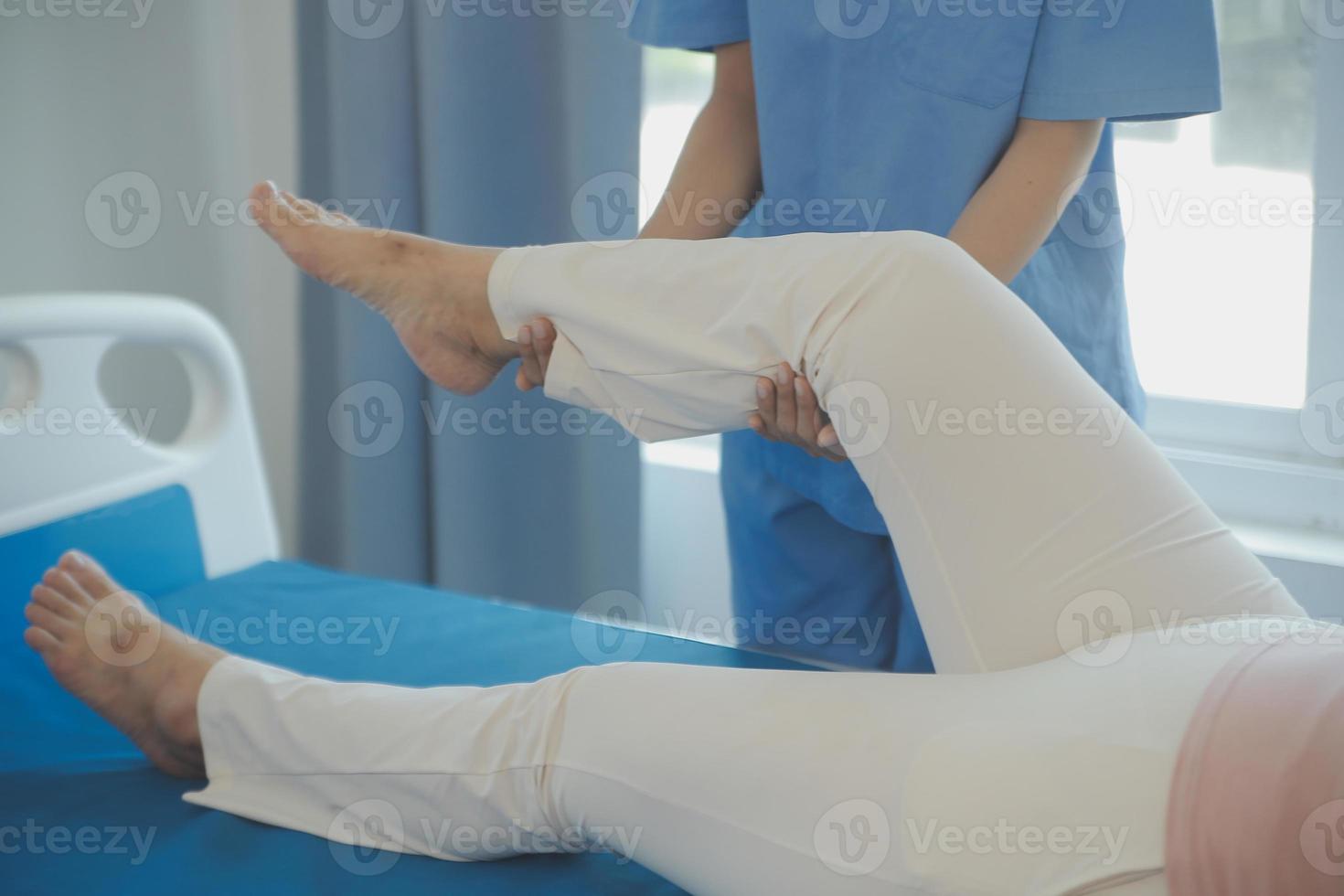 Patient doing some special exercises under supervision in a room photo