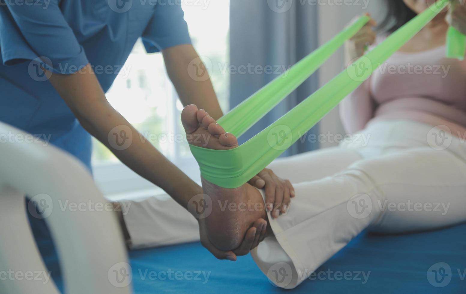 Patient doing some special exercises under supervision in a room photo