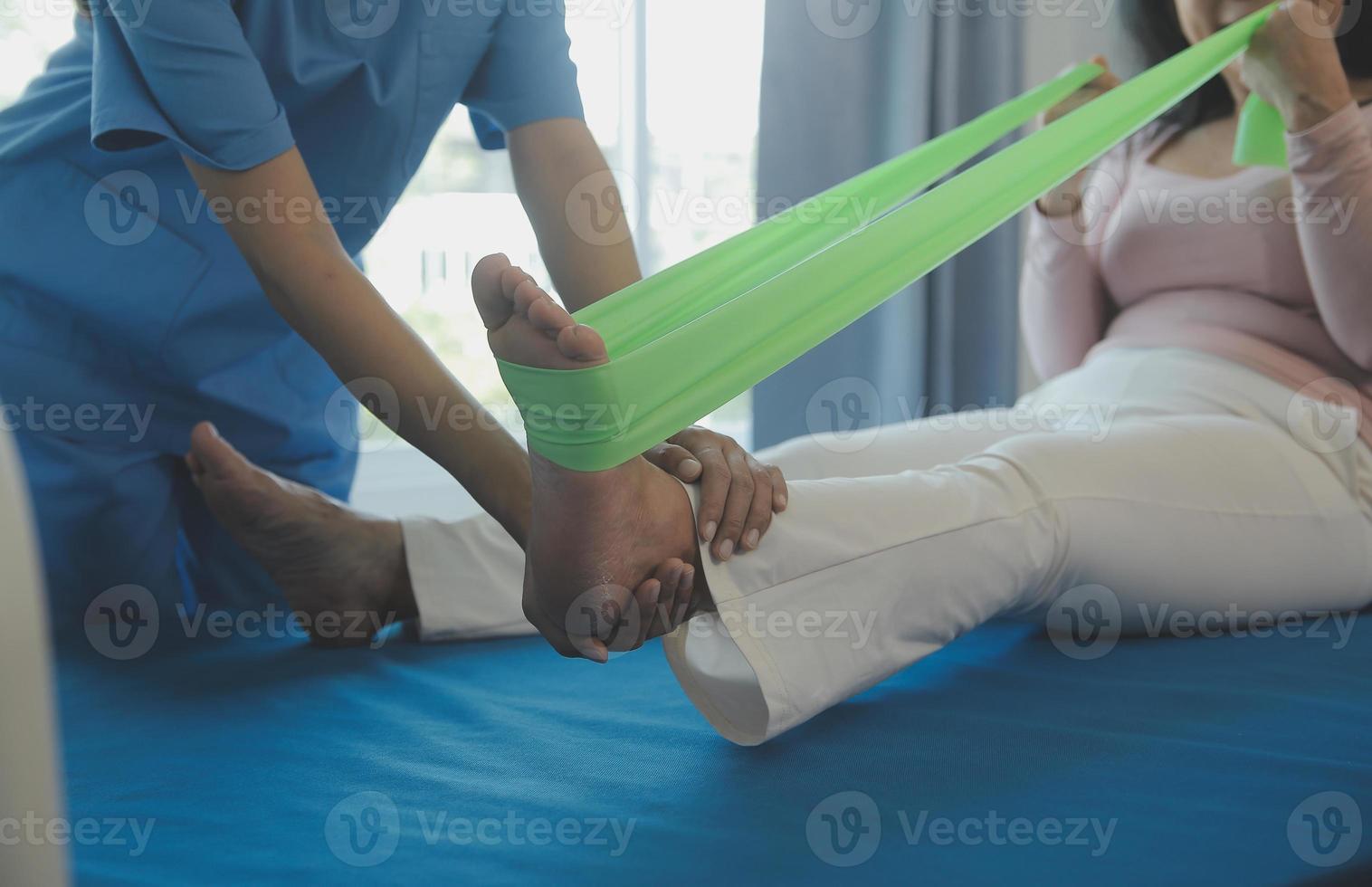 Patient doing some special exercises under supervision in a room photo