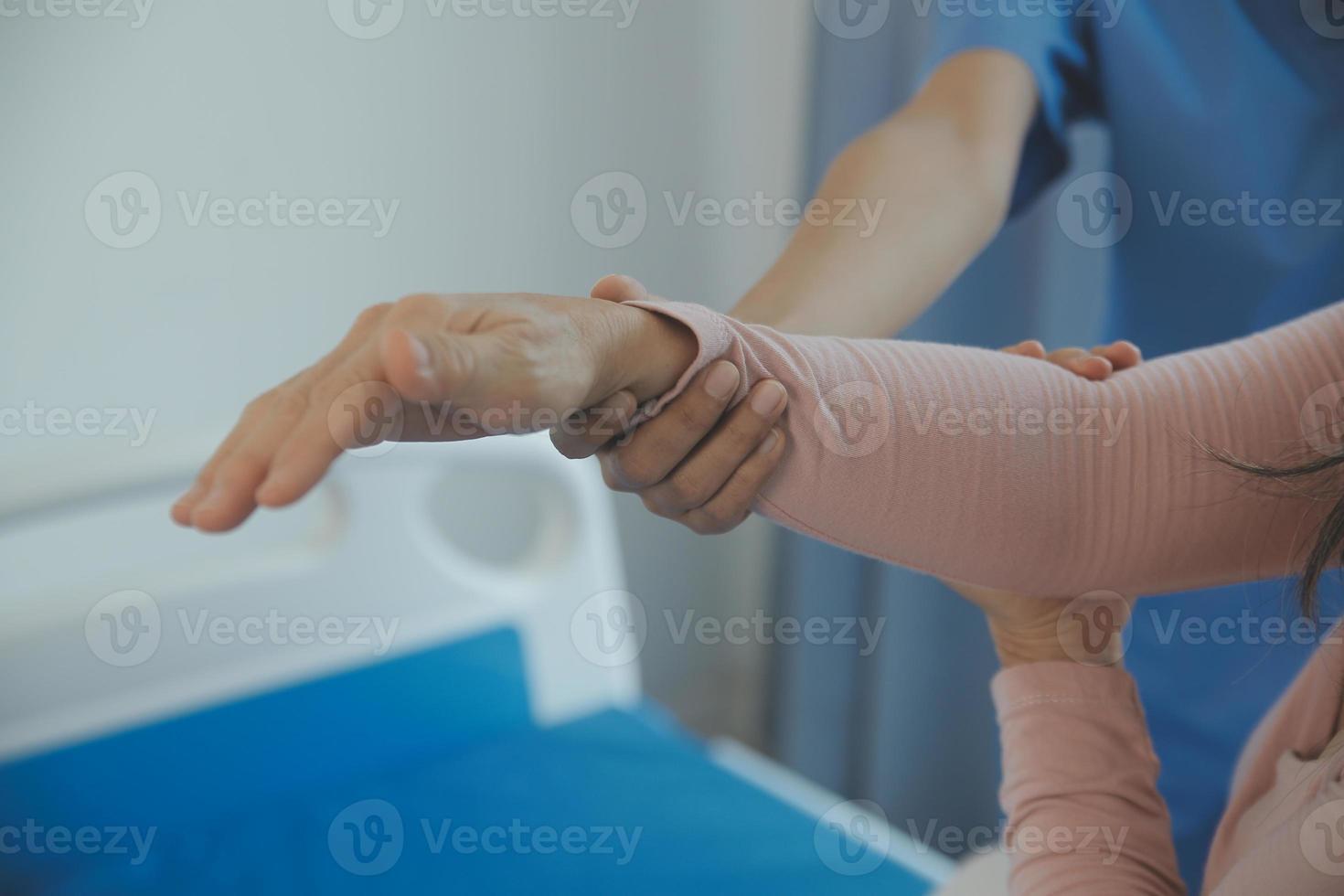 Patient doing some special exercises under supervision in a room photo