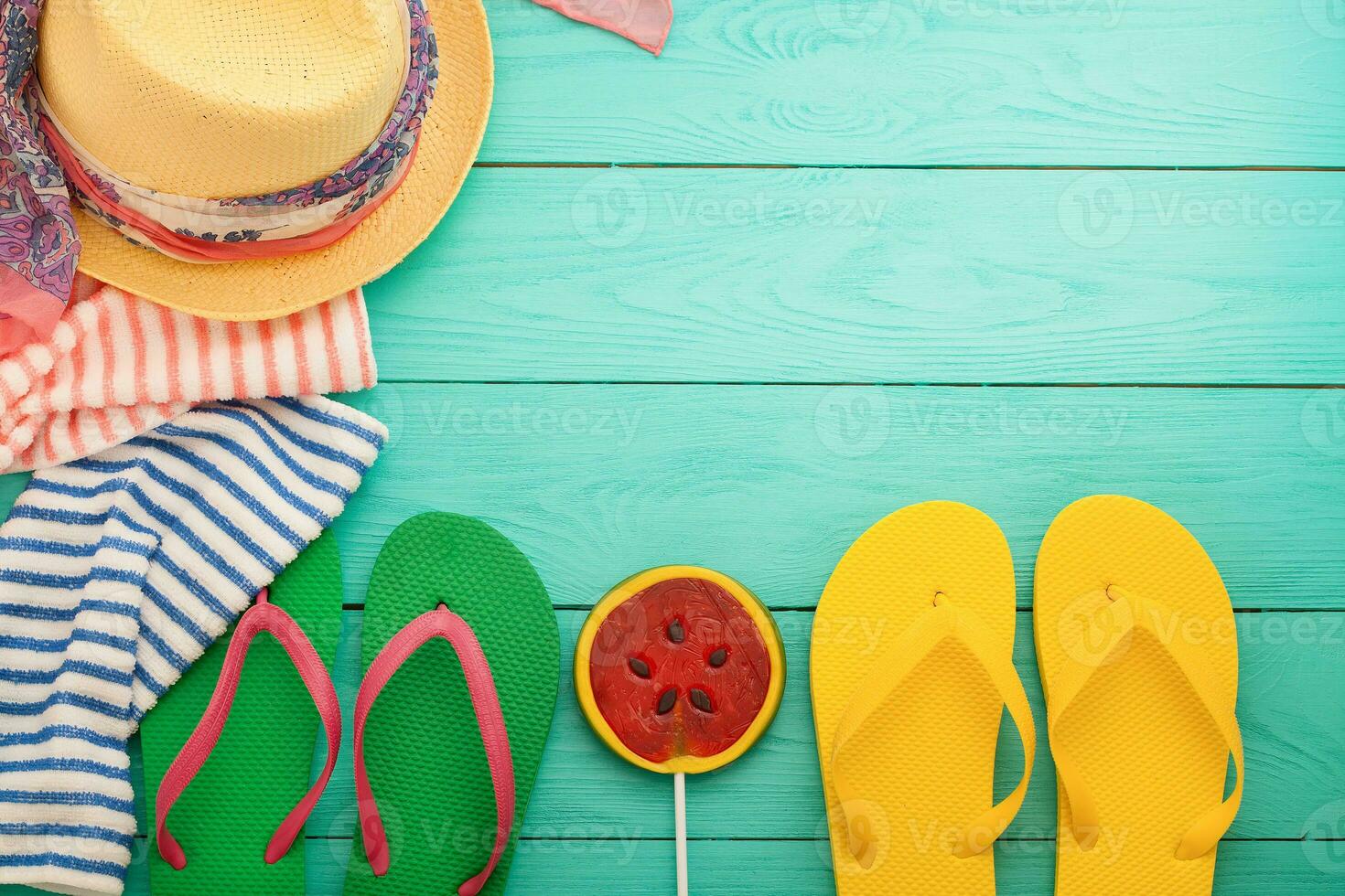 Summer accessories and copy space on blue wooden background. Top view photo