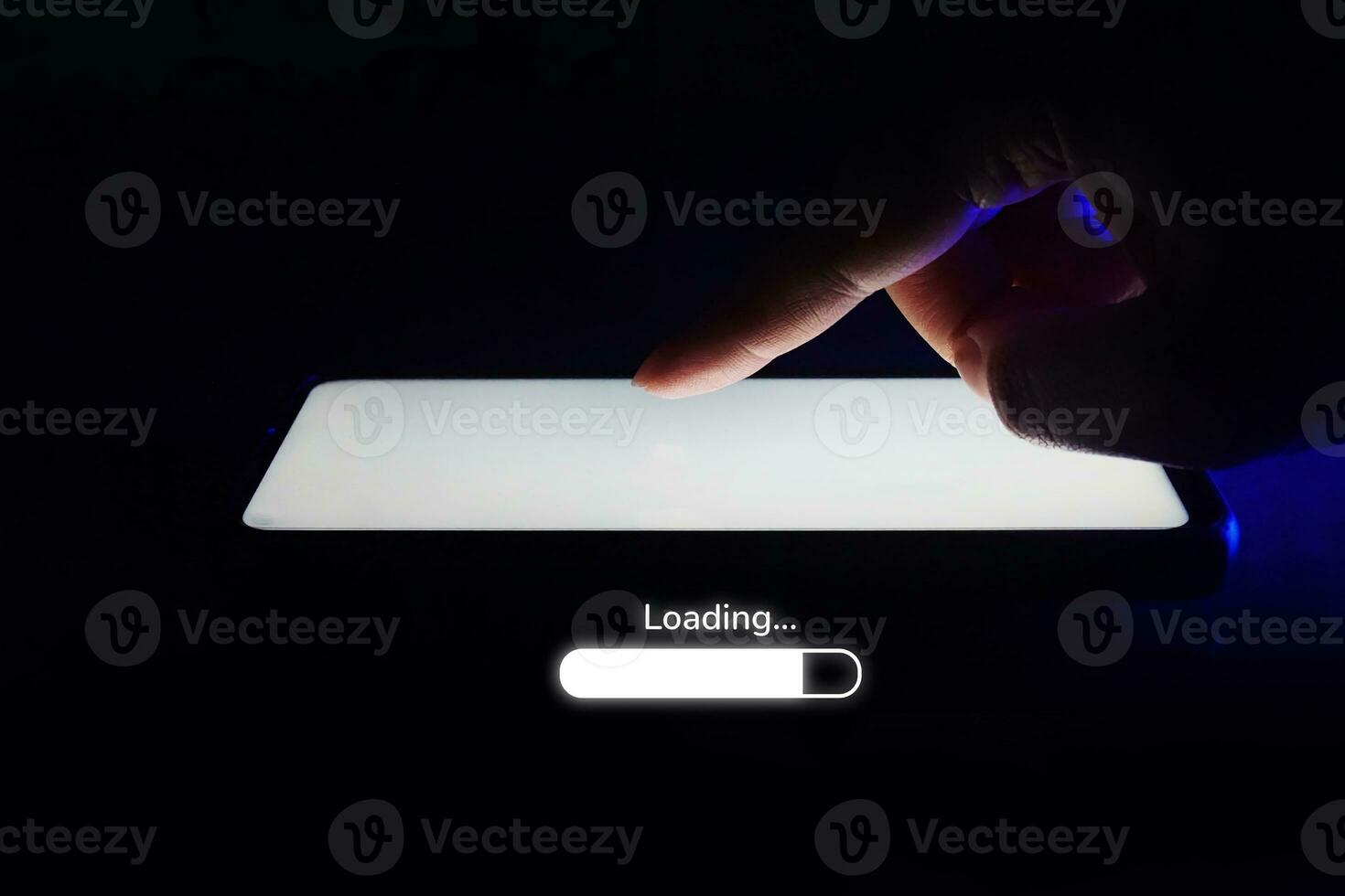 Mobile Phone and loading icon Isolated on dark background. photo