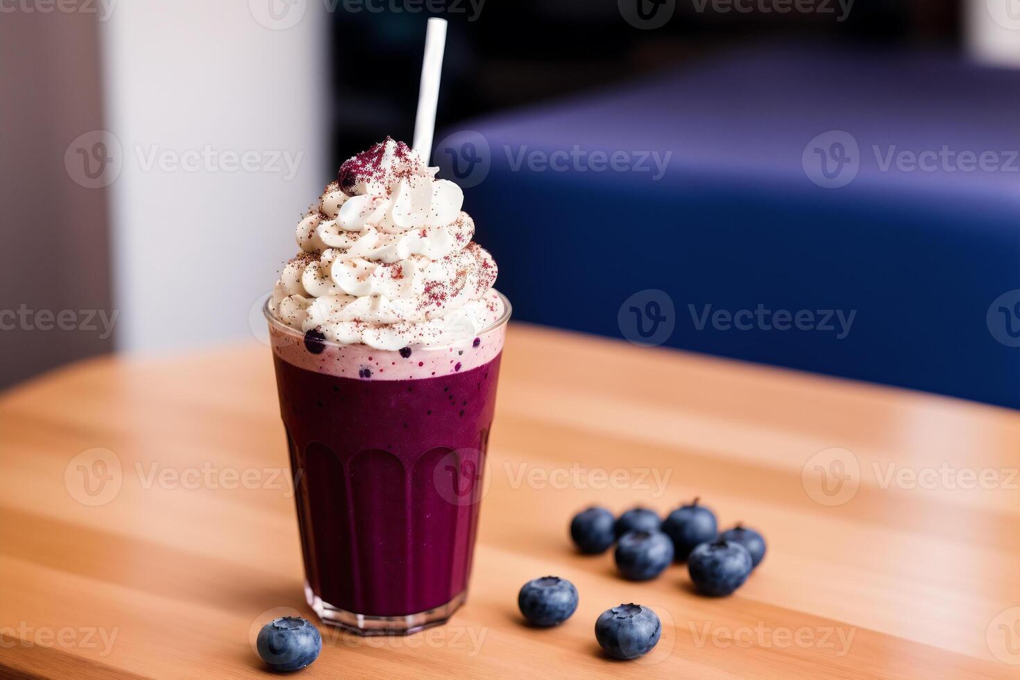 A glass of milkshake with whipped cream and blackberries.Strawberry milkshake, Raspberry milkshake. photo