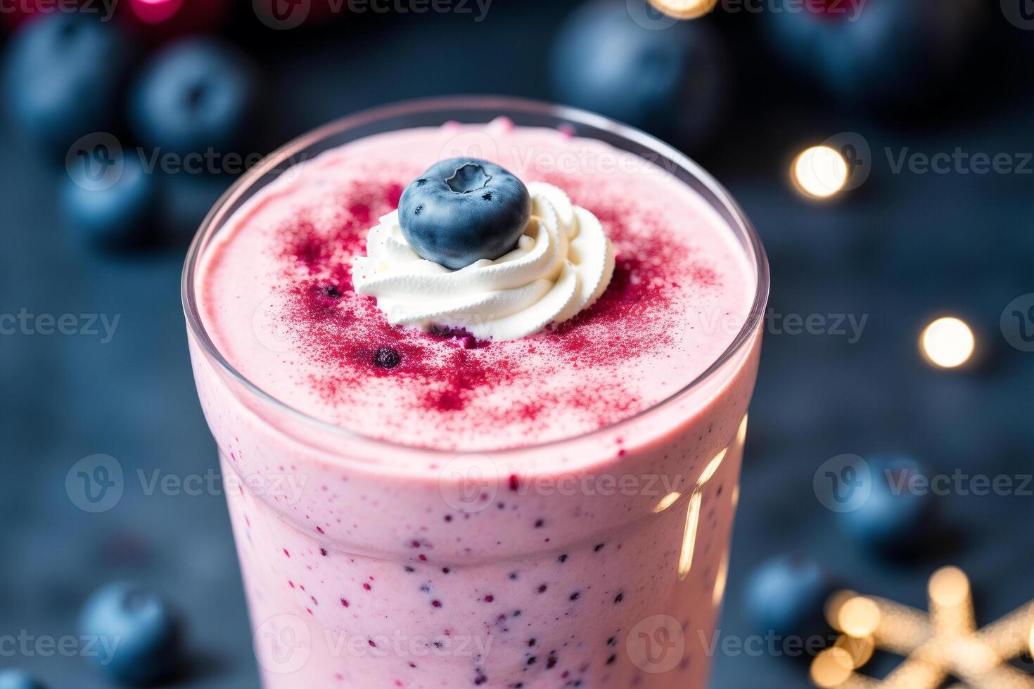 A glass of milkshake with whipped cream and blackberries.Strawberry milkshake, Raspberry milkshake. photo