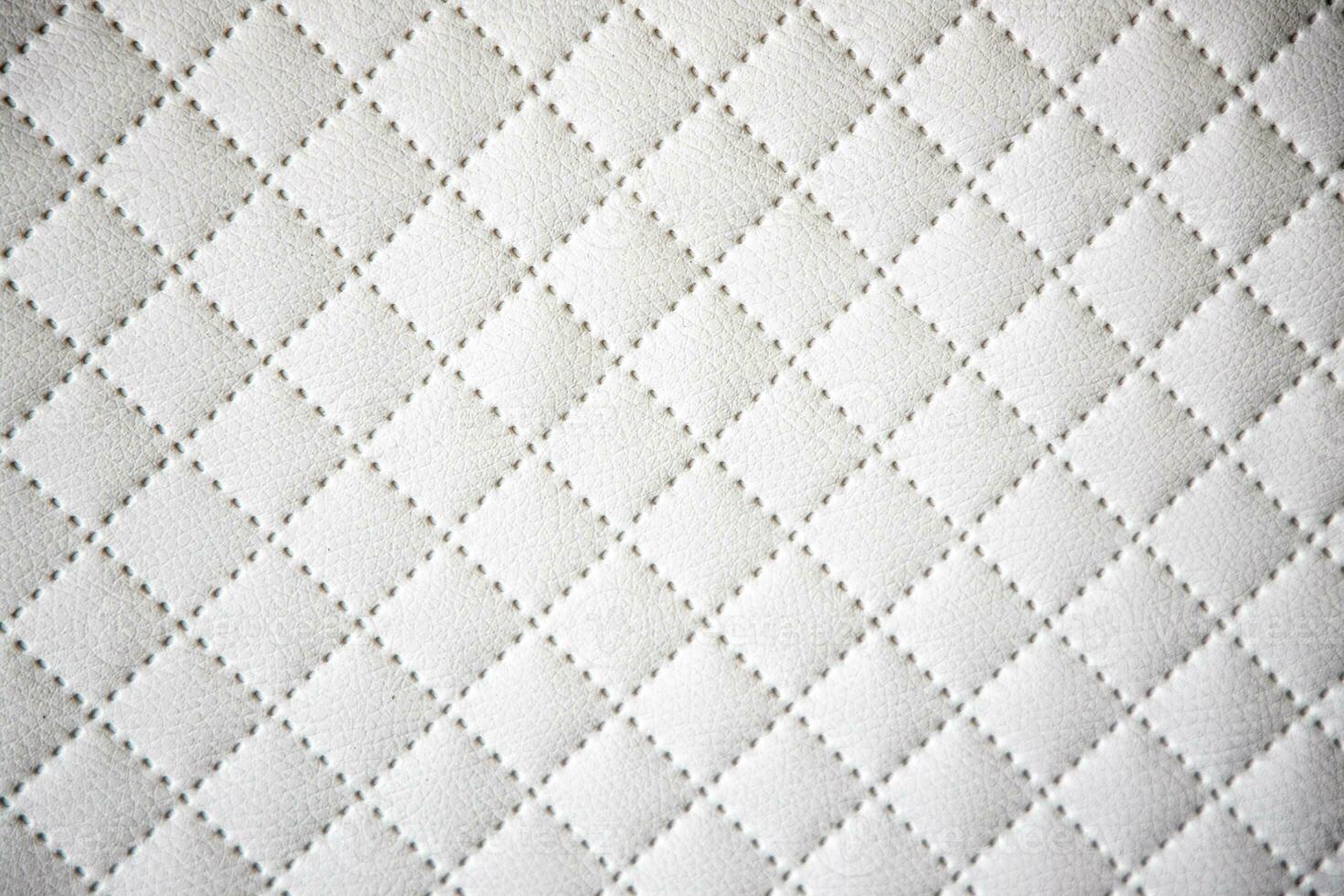 interesting original white leather background with quilting pattern photo