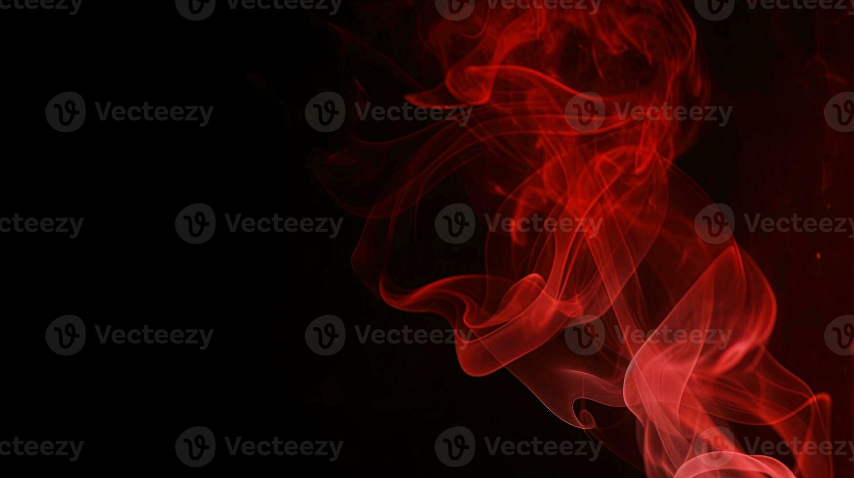 Red smoke on black background. Abstract colorful smoke on black background. photo